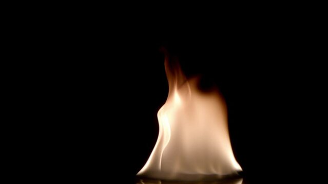 Fire on a black background close-up in slow motion. Natural footage of fire.