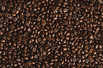photo macro close up texture of roasted coffee beans dark, can be used as a background.