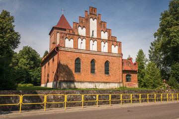 Gothic church in village Kuty, Masuria, Poland - obrazy, fototapety, plakaty