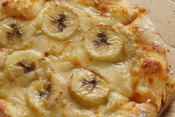 Home delivery banana mozzarella cheese sweet pizza top view