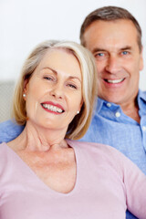 Smiling mature woman and man together having a good time. Closeup portrait of a smiling mature woman and man together having a good time.