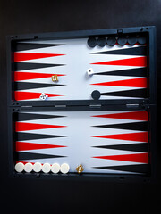 Backgammon game isolated on black background.