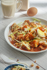 Popular Malaysia Pasembur or Rojak. Indian influenced salad mix with thick gravy peanut sauce, fritters, tofu and cucumber