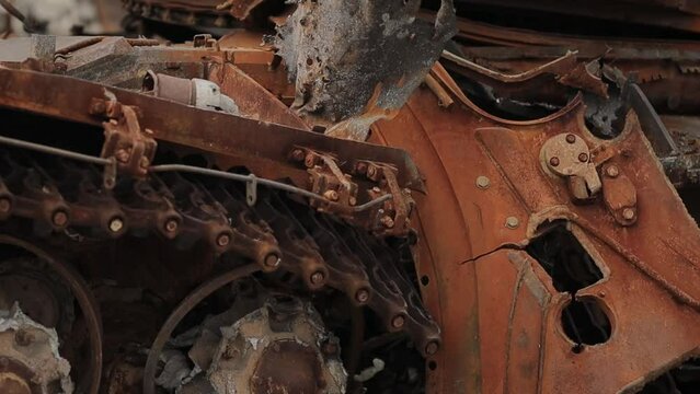 Kyiv, Ukraine - December 15, 2022: Burnt rusty part of a burnt Russian T-72 tank in Ukraine, close-up on the street. Burnt Russian military equipment in the center of Kyiv. War in Ukraine.