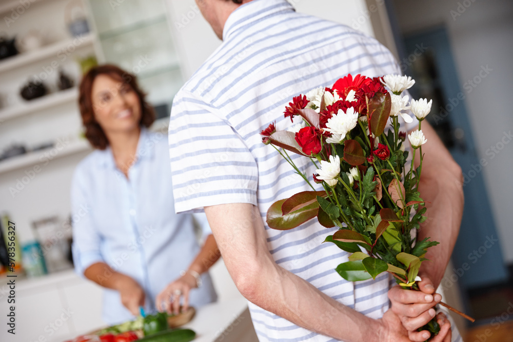 Sticker Keeping their love fresh. a husband surprising his wife with a bunch of flowers at home.