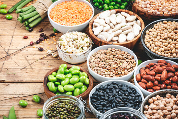 Legumes, beans and sprouts. Dried, raw and fresh, top view. Lentils, mung beans, chickpeas, soybeans, edamame, peas, Healthy diet food, vegan proetin, micronutrients and fiber sources