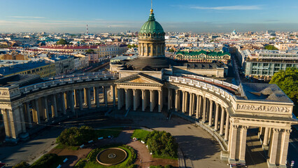 Fototapeta premium Aerial view of the Kazan Cathedral and the river in the historical and at the same time modern city of St. Petersburg at sunny summer dawn 