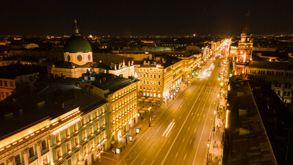 Fototapeta na wymiar Aerial view of the Nevski street and Kazan Cathedral next to House of the Singer company in the historical and at same time modern city of St. Petersburg at night 