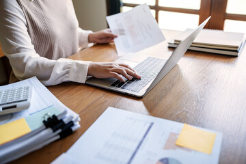 Business Professional Chartered Accountant Woman working with computer and calculator Sales Invoice Accounting