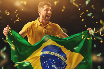 Young happy man, soccer fan emotionally cheering up favourite brazil football team. Live...