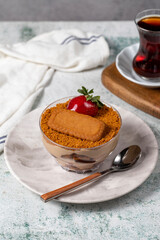 Homemade Strawberry Custard Pudding. Biscuit and strawberry dessert. Turkish magnolia dessert in glass bowl