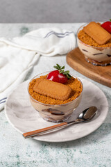 Homemade Strawberry Custard Pudding. Biscuit and strawberry dessert. Turkish magnolia dessert in glass bowl