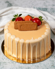 Strawberry, biscuit and white chocolate birthday cake. Chocolate birthday cake with chocolate ganache drip icing