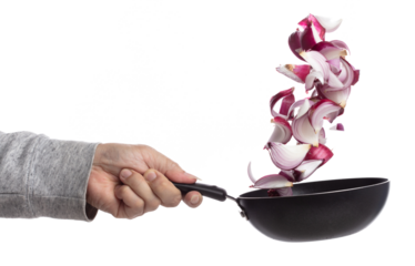 Shallots fall fly in pan, red fresh vegetable spice shallots onion floating. Organic fresh herbal shallots root head cut chop slice. White background isolated freeze motion high speed shutter