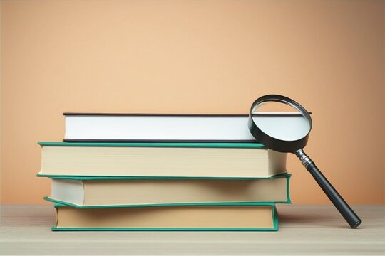 a magnifying glass focusing a stack of books