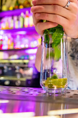 man hand bartender making cocktail in glass on the bar counter