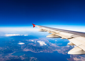 view of the wing of an airplane through the window