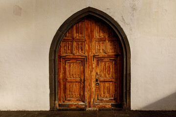 Heavy oak arch door of Church or castle.
