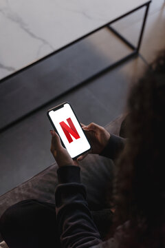 Mobile phone with the Netflix Logo on the screen
