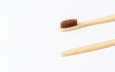 Wooden toothbrush on a light background. Zero waste concept. Everyday eco-friendly items made from biodegradable materials. copyspace.