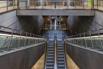 Interior view at hallway escalators to metro at Copenhagen Airport, Denmark.