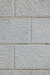 Brickwork covered with white paint. Background from white unequal rectangles.