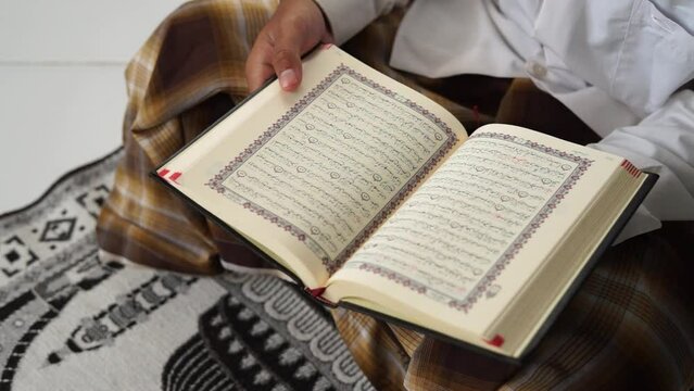 Man read holy Quran book