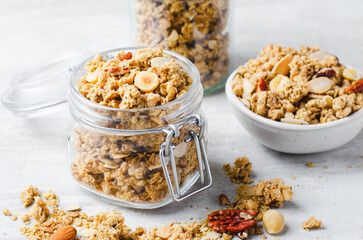 Granola with Nut Mix on Bright Concrete Background, Healthy Vegan Snack or Breakfast