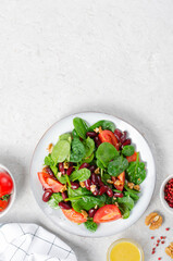 Red Bean Salad On Bright Background, Fresh Salad with Spinach, Cherry Tomatoes, Walnuts, Beans and Mustard Dressing