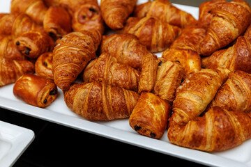 Delicious crunchy croissants at a breakfast buffet at a hotel.