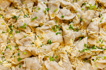 Steamed Dumplings Served with Spring Onions and Oil