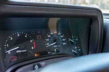 Car dashboard detail view with speedometer