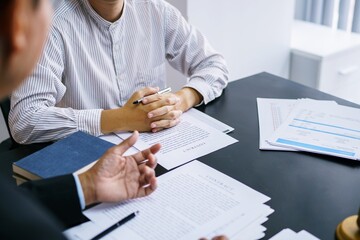 Lawyer Legal counsel presents to the client a signed contract with gavel and legal law. justice and lawyer Business partnership meeting concept.