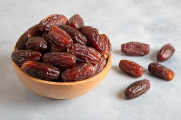 Date fruits in wooden bowl,closeup