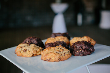 white platter of levain bakeshop cookies: chocolate chip, walnut, double chocolate