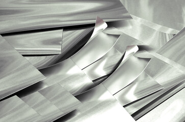 aluminum metal sheets. industrial metal pile, production rectangular pieces. curved material