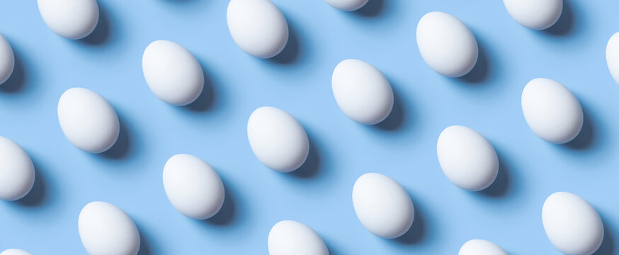 Creative banner with pattern from white eggs on blue background. Easter minimalistic concept