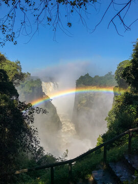 The iconic Victoria Falls,  Mosi-Oa-Tunya waterfall, view from the Zimbabwe side, with a rainbow.