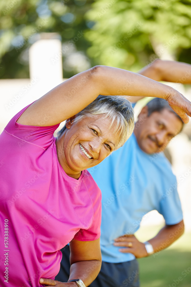 Canvas Prints Staying fit and having fun together. Portrait of a mature couple exercising together in their backyard.