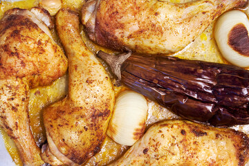 Baked chicken, chicken and eggplant. Hot food from the oven. Traditional satsivi