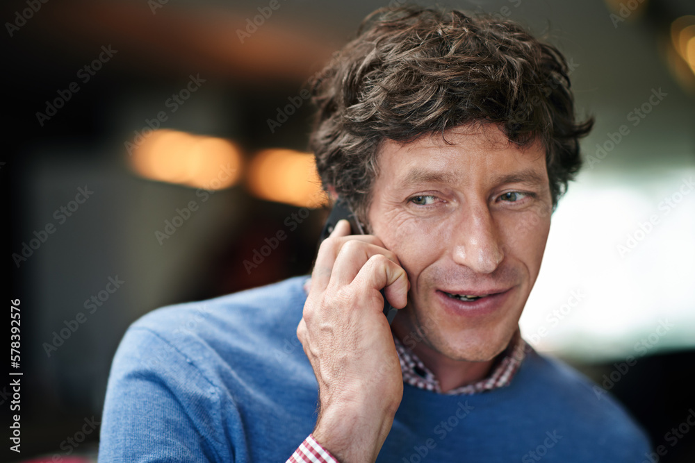 Poster calling a client. a businessman using his cellphone at work in an office.