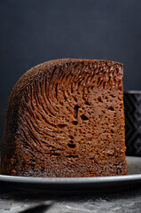 Baba Neagra, Black Baba, Traditional Moldavian Dessert on Dark Background