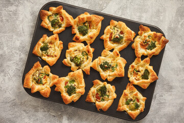 Savory puff pastry muffins with broccoli and mozzarella.    - obrazy, fototapety, plakaty