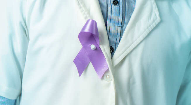 Epilepsy Awareness day image, doctor with purple ribbon on his coat, World purple day background