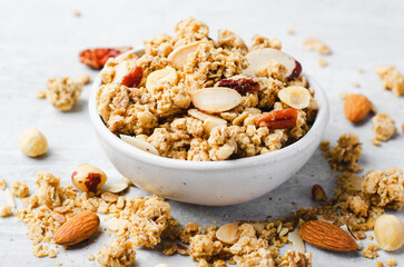 Granola with Nut Mix on Bright Concrete Background, Healthy Vegan Snack or Breakfast