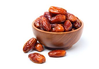 Dried dates fruits in wooden bowl isolated on white background.
