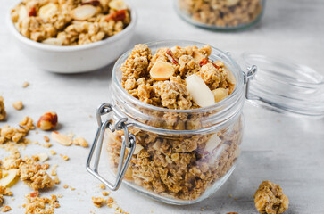 Granola with Nut Mix on Bright Concrete Background, Healthy Vegan Snack or Breakfast