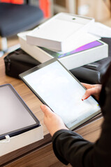 people holding cell phone and tablet