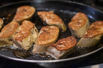 Cooking foie gras over pan
