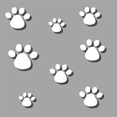 Fototapeta premium Vector background with dog paws. Background of animal paws. Dog paw icon on gray background vector.